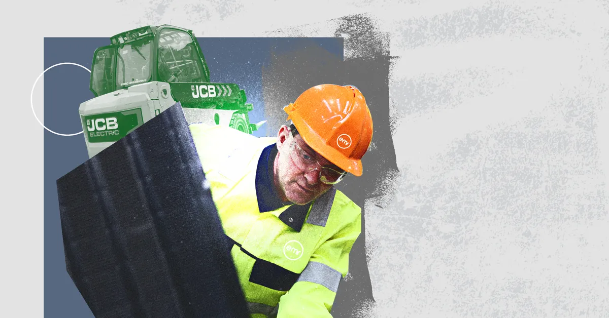A construction worker in a high-visibility jacket and orange hard hat handling a large black panel near green construction vehicles.