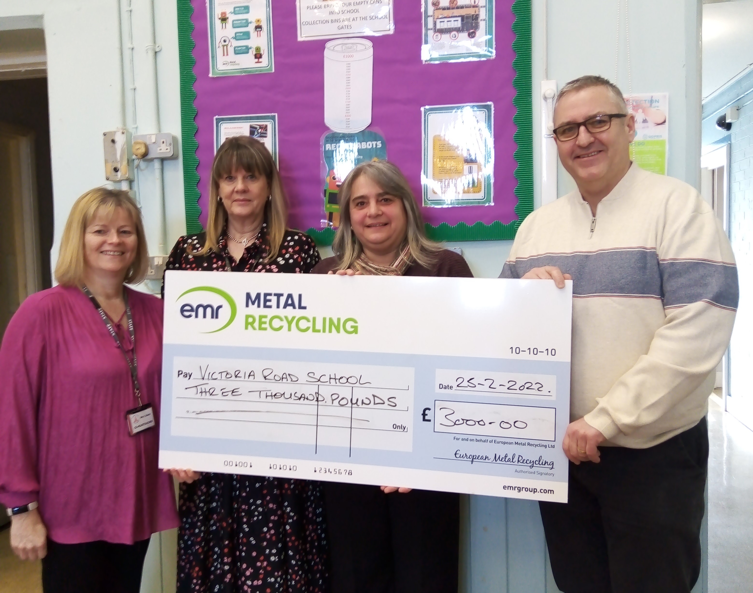 Sam Taylor, Commercial Manager at EMR Ashford, awards donation to Victoria Road Primary School
