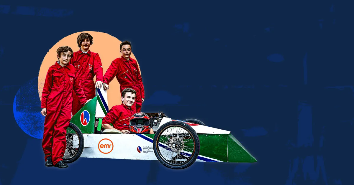 A group of four people in red racing suits posing with a green and white race car.