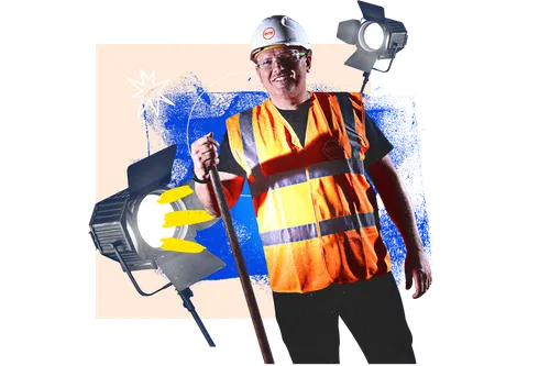 A person in a hard hat and high-visibility jacket smiling and standing in front of an orange background.