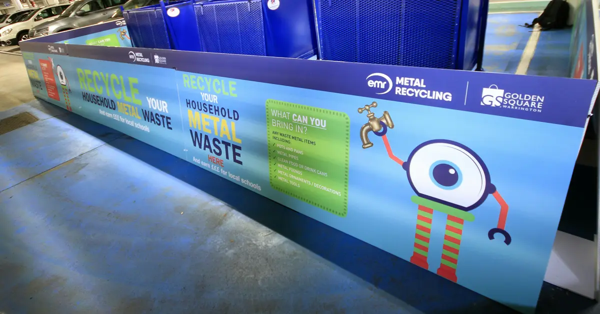 EMR Metal Recycling bin in a car park.