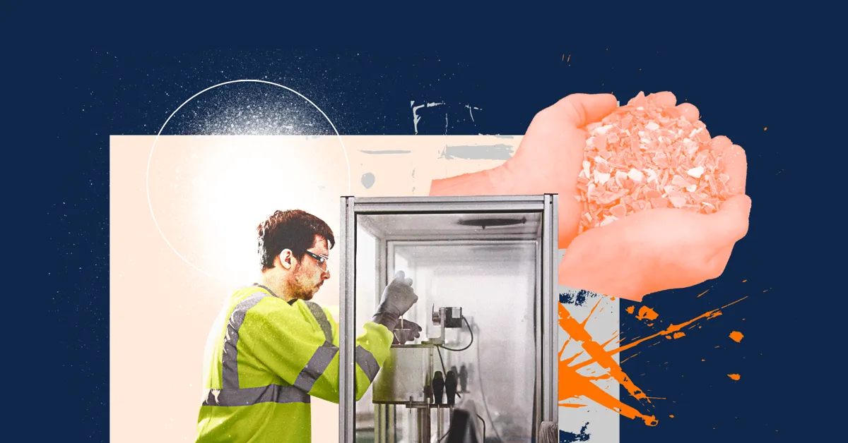 A person in a high-visibility jacket spraying a substance inside a metal container.