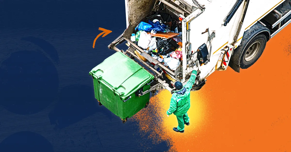 A person in a green uniform loading a green bin into a refuse truck