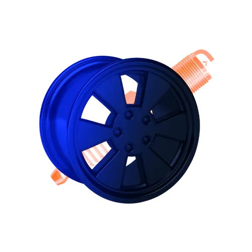 A blue alloy wheel in front of a large orange spark plug