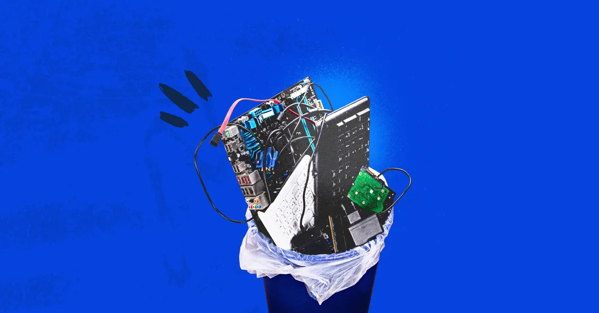 A blue trash can with a computer keyboard and other electronic parts sticking out of it.