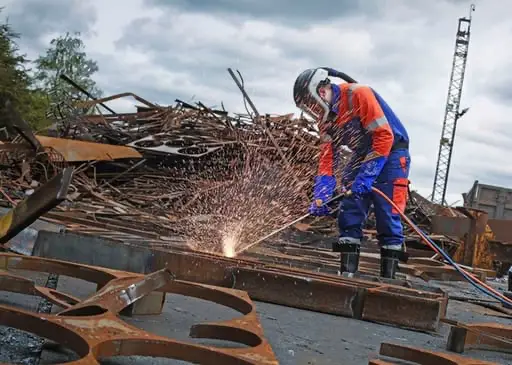 Person welding with sparks flying